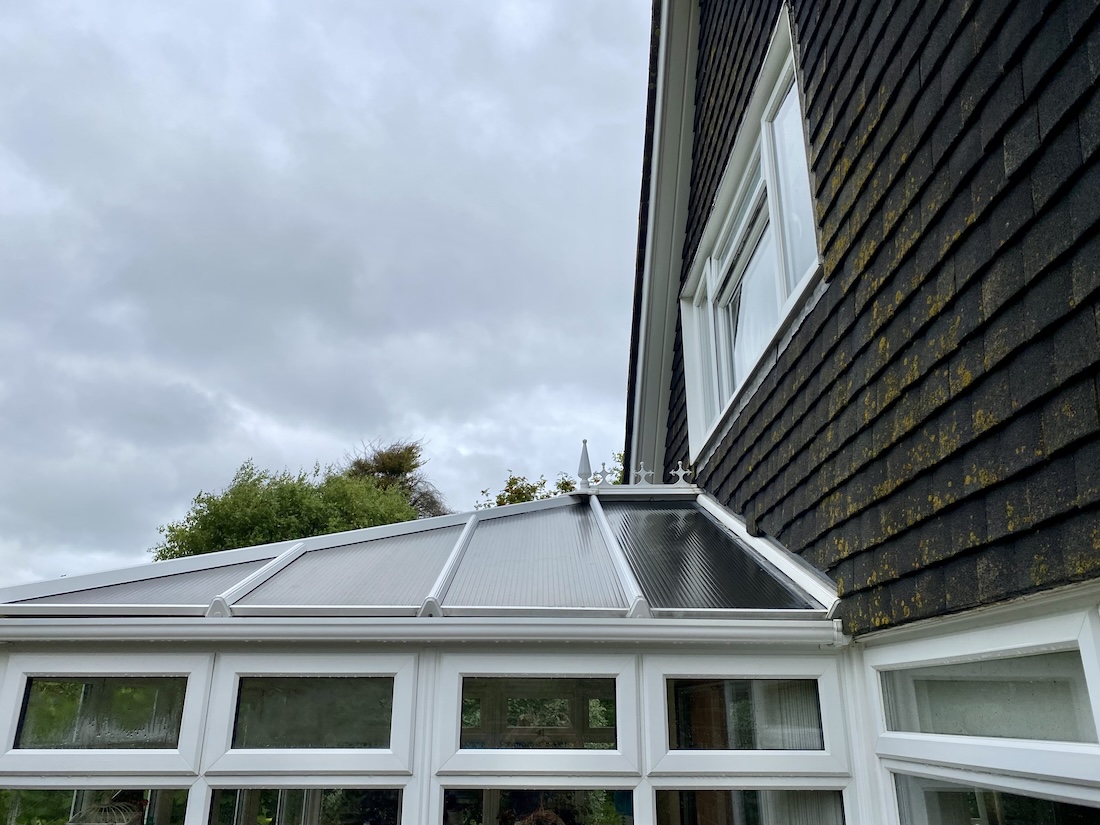 A clean conservatory roof and windows.