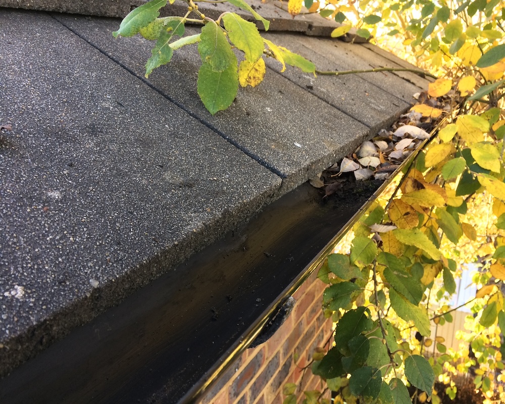 Gutters being cleared of leaved.